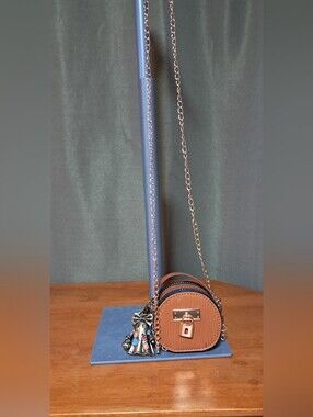 Brown Round Crossbody Bag with Charm Halloween Feel.. 3 By 3 Inch